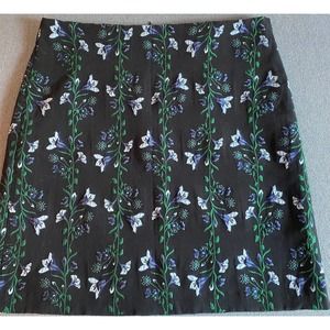 Ann Taylor Woman’s skirt size 12 black with green blue floral design lined FLAW